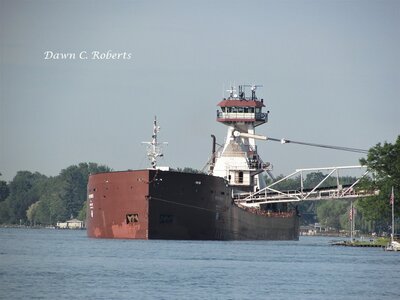 Tug Dorothy Ann discharging cargo from her barge Pathfinder, at the Marine City stone facility.