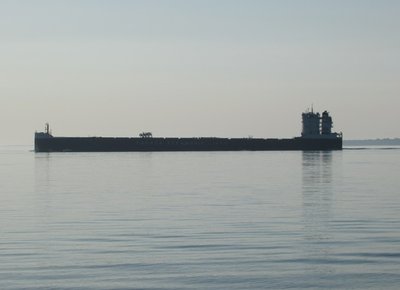 CSL Welland silhouetted against the sun as she heads to Thunder Bay.