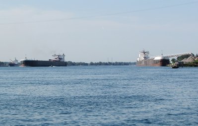 American Century moving up river, past H. Lee White, still in the process of unloading. Algoscotia can be seen in the background (far left), sitting at the Corunna fuel dock.