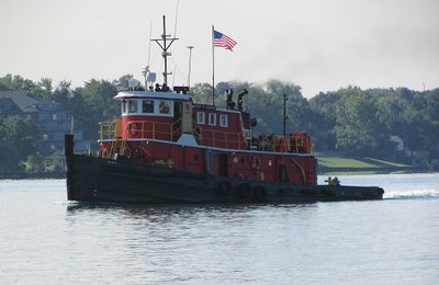 The tug Kurt R. Luedtke was moving up-river at a posted speed of 2 knots/hr., pulling a string of barges to an unspecified destination.
