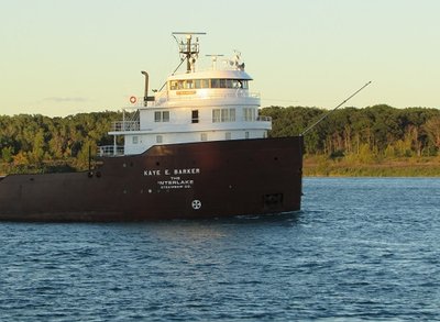 The last rays of sun reflect off Kaye E. Barker's pilot house, Wednesday evening.  She was taking another load of Marquette taconite to the AK Rouge facility.