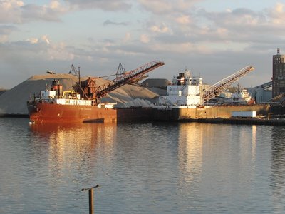 Love the stern reflections of these two freighters.