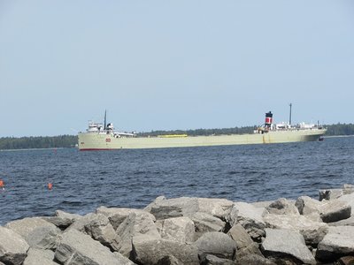 Alpena behind the rocky break-wall, turning toward the dock.