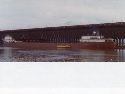 Leon Falk Jr. loading at West of #6 Missabe, Duluth. Bumboat Marine Trader along side.