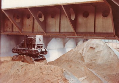 Hulett bucket taking a bite out of our "red ore" cargo.