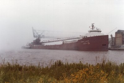 Herbert C. Jackson unloading in the fog at <br />Cutler-Magner, Superior. Reiss Marine along side.