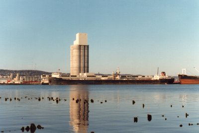 Red Wing unloading cement at St. Lawrence Cement. Photo taken from Connor's Point, Superior. There was no fishing pier under the old Interstate Bridge in Duluth when this photo was taken.