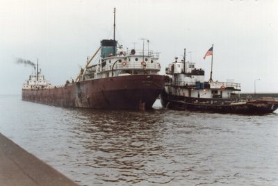 Outbound Duluth with tug Malcolm.