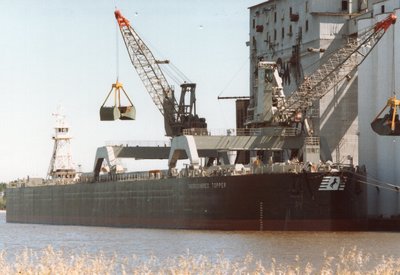 Tug Five Brothers and barge Thoroughbred Topper at Elevator "M", Superior, for securing. Loaded grain at Continental Grain, Superior.