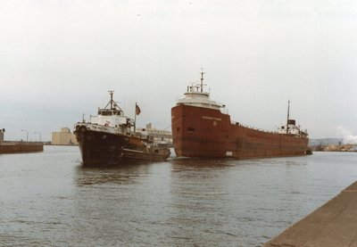 Tug Malcolm, Eugene P. Thomas, and "G" tug New Jersey outbound Duluth.