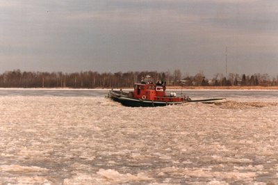 "G" tug Arkansas breaking ice in Duluth harbor.