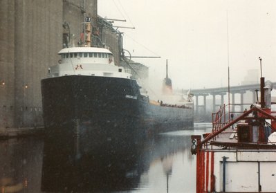 Loading in the snow. Harvest States #2. 11/24/90.