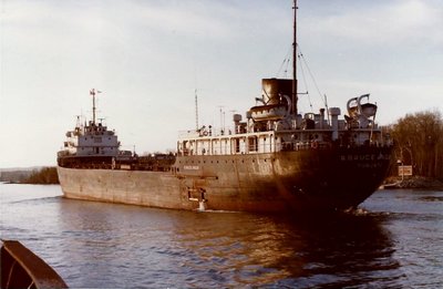 R Bruce Angus slides by off Sugar Island