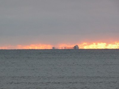 Not only were the early morning skies red, there was also the appearance of gaseous clouds below the gray cover.