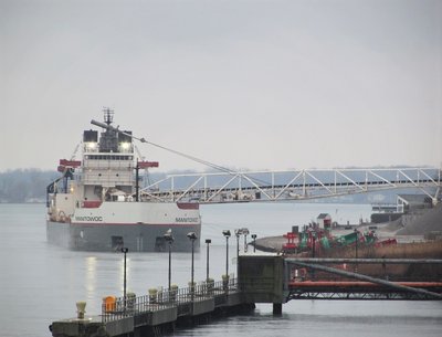 Manitowoc discharging cargo at Blue Water Aggregates in Marysville -- a challenging location for the photographer.