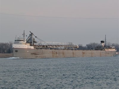 Cuyahoga (came out of Detroit but shows no current destination) passes above Marysville as daylight fades.