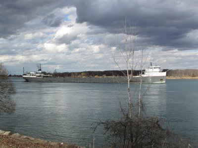 A few hours later, rain clouds form overhead as Ojibway (Windsor) passes Stag Island.