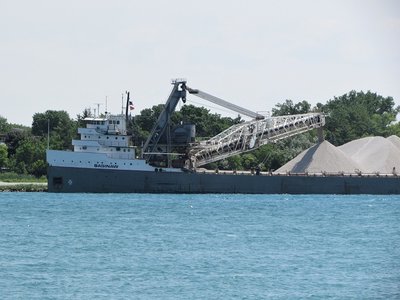 Close-up of Saginaw unloading stone.