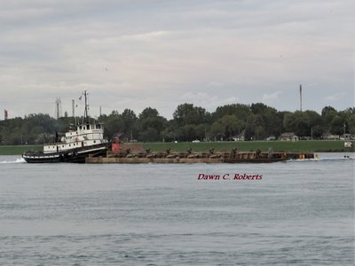 Tug Manitou making good speed down-bound to an unspecified destination.