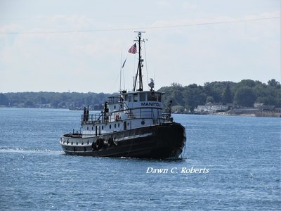 Tug Manitou approaching her dock.