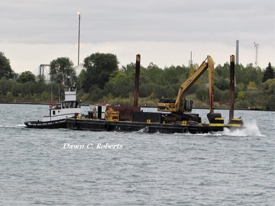 Tug Capt. Keith and work barge bucking waves as they approach the Malcolm Marine dock, above Marysville.