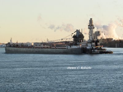 Victory and barge Maumee (Sault Ste. Marie) moving past the steam plumes of Chemical Valley. (Her elevated pilot house appears a bit taller because it was in line with one of the chemical facility towers.)