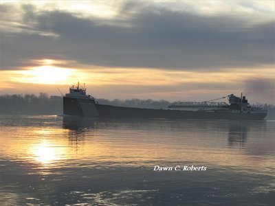 Arthur M. Anderson (Calcite), glides into a misty pool of sunlight at the River Crab.