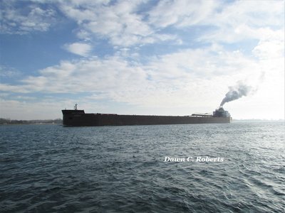 James R. Barker (Superior) leaves cloudy, foggy weather behind.