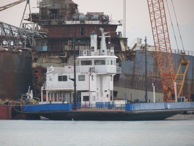 IMG_1442.jpg (100.82 KiB) Viewed 2271 times Car ferry at International Marine Salvage scrapyard in Port Colborne, Ontario with the remains of Algoway and Algorail in background.