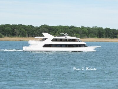 Everything money can buy for personal pleasure. Infinity, with no noted destination making good speed down river at Stag Island.