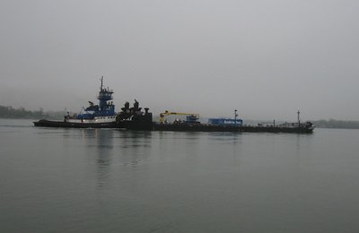 Early morning found her pushing a barge to Toledo