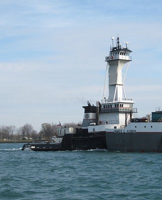 Moving her barge down river to Toledo