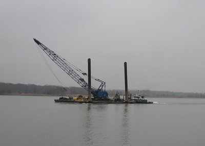 Slowly pushing the work barge toward Sarnia and work above the Black River, on the US side