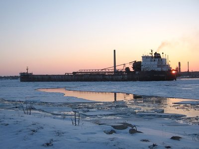 Sun breaks the horizon at Cresswell's stern.