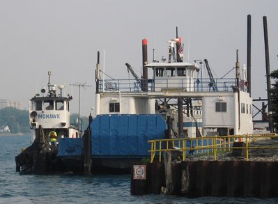 Both were pulling barges but there was no accessible place to get a complete picture.