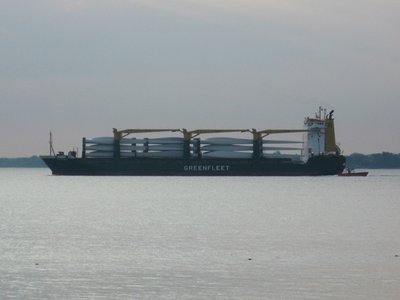 Loaded with wind turbine blades for a Duluth delivery.  A pilot boat is at her stern.
