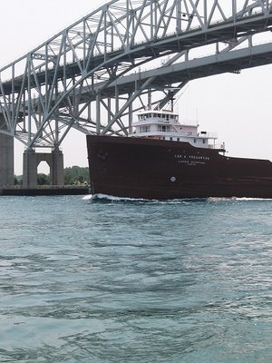 Lee A. Tregurtha glides under the Bluewater Bridges and out onto Lake Huron, with a destination of Duluth