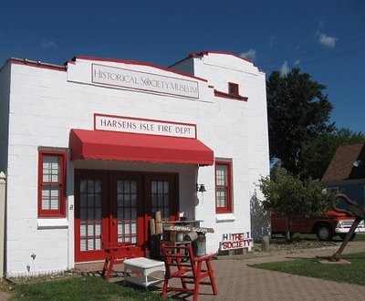 The Harsen's Island Historical Society's home is the former Fire Department building.  The partially visible classic truck (on the far right) served as a rescue vehicle.