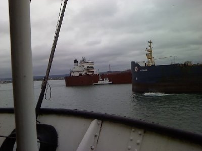 The Edgar B. Speer + ojibway pass the Algolake behind the valley camp