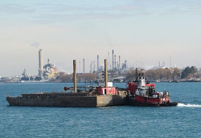 Tug Kathy Lynn moves her barges up river.