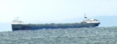 ship anchored in Whitefish Bay, much calmer seas and smaller ship, unladen.