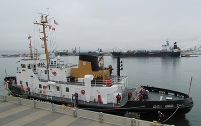 Tying up, as the Algoma Hansa tow passes in the background.