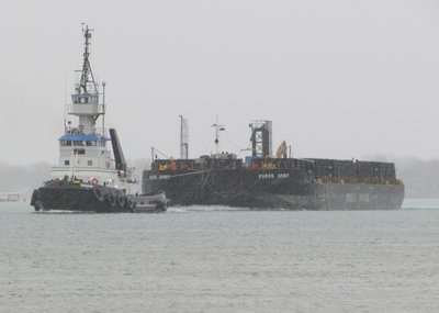 Leonard M and barge in a brief snow squall, up-bound to Sault Ste. Marie.