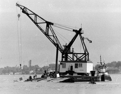 June 25, 1972 - The Smith's hull is now completely seperated. U S Army COFE derrick barge is anchored to the bottom and the stern of the Smith