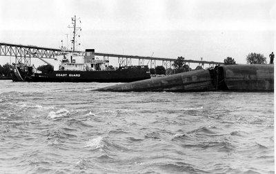 USCGC Acacia places a buoy to mark the upper end of the Smith wrecks bow. The USCG wanted to maintain a safe distance from the wreck and the now one-way alternating vessel traffic in the river.