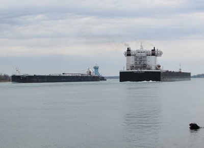 Up-bound Ken Boothe, Sr. and barge Lakes Contender (Stoneport) and down-bound American Integrity (St. Clair Power Plant) meet on a curve in the river.
